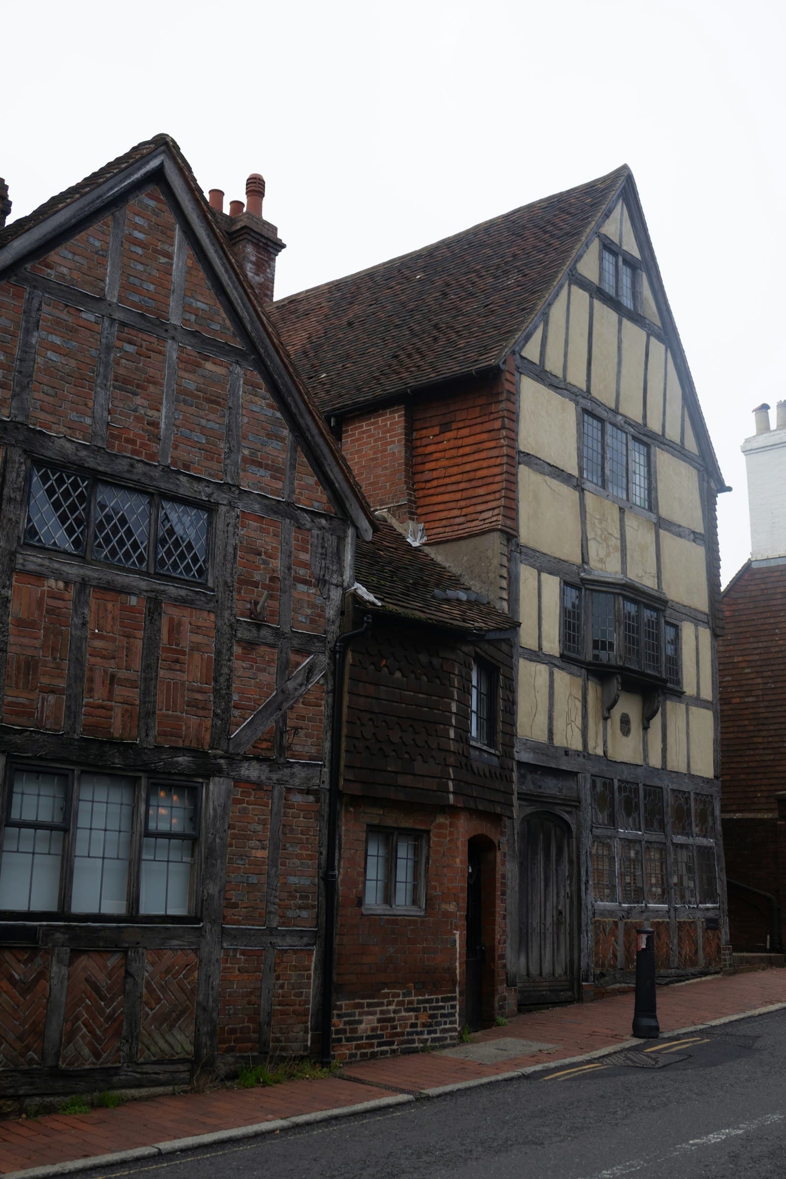 Old timber-framed buildings on a narrow street
